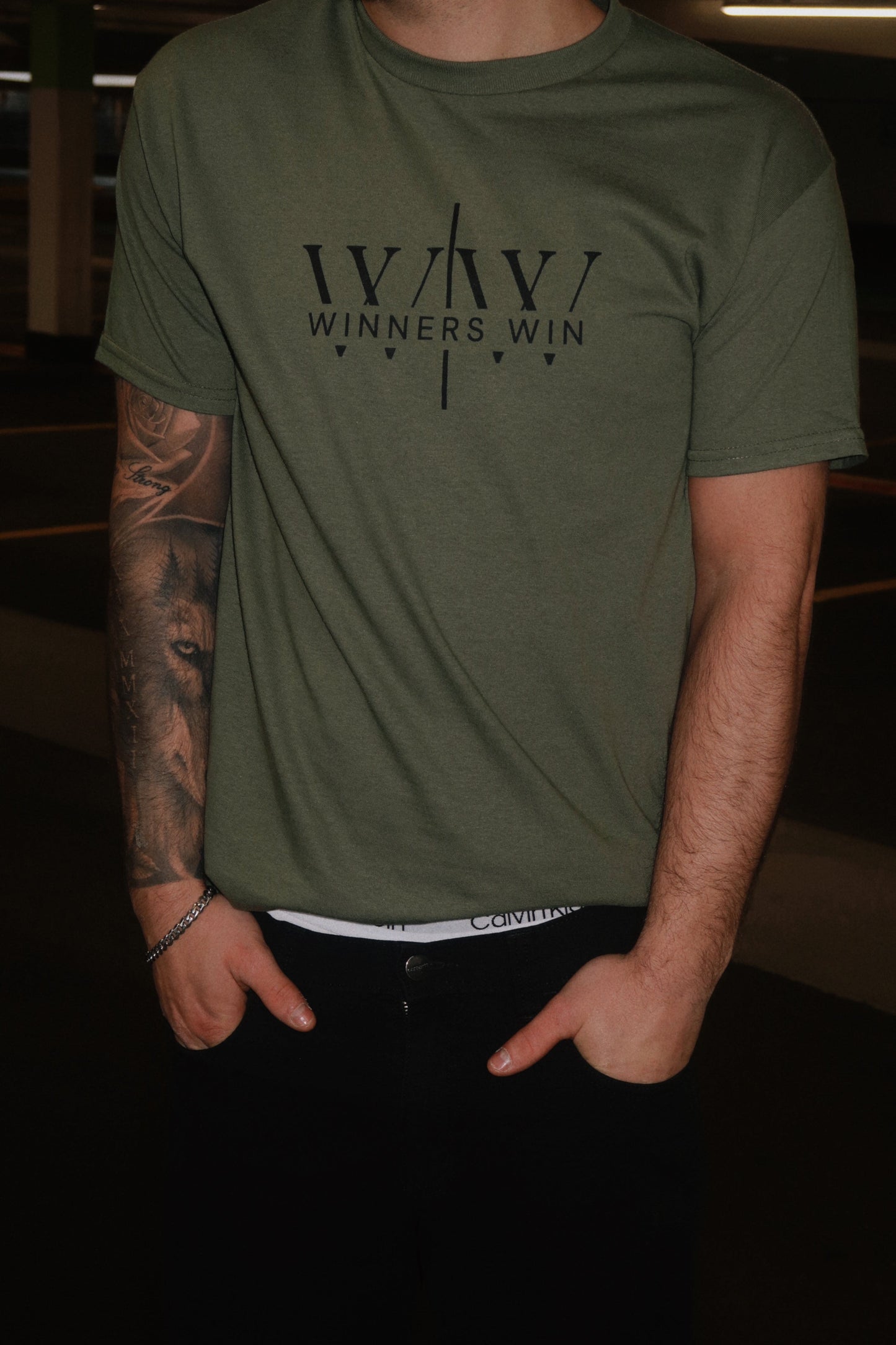 Winners Win core t-shirt in khaki being modelled in a photoshoot in Belfast