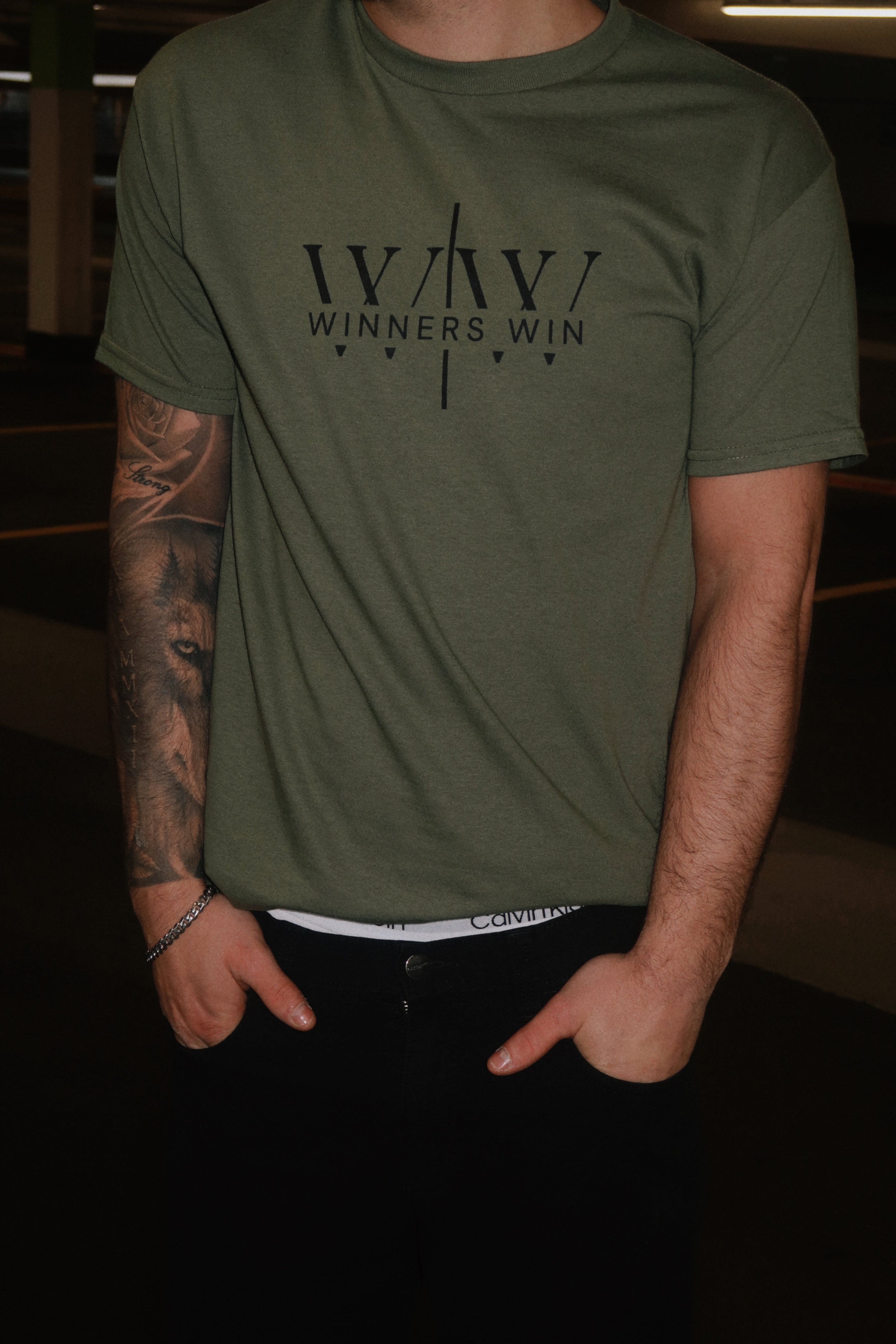 Winners Win core t-shirt in khaki being modelled in a photoshoot in Belfast