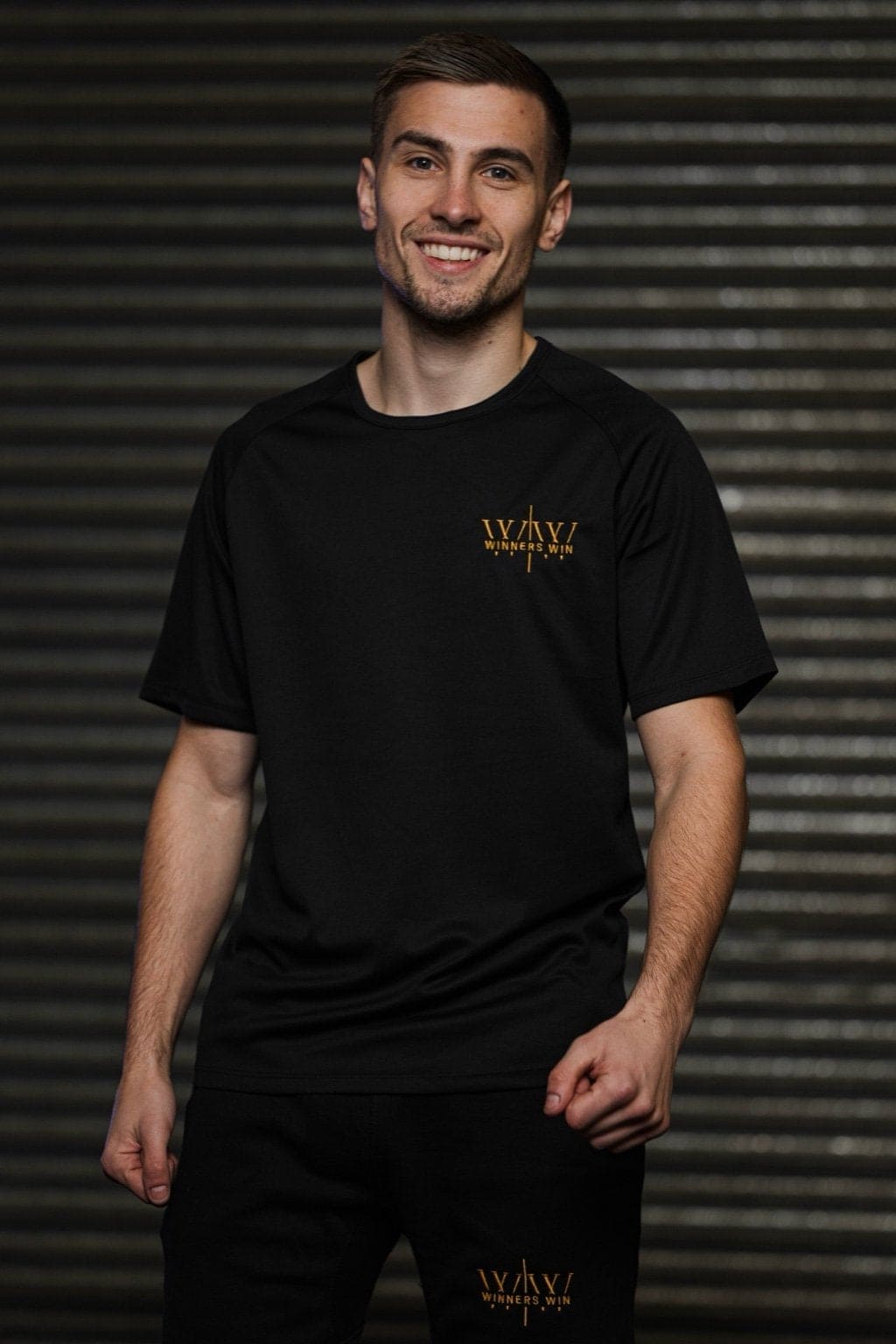 Paul Loonam wearing the winners win gym t-shirt