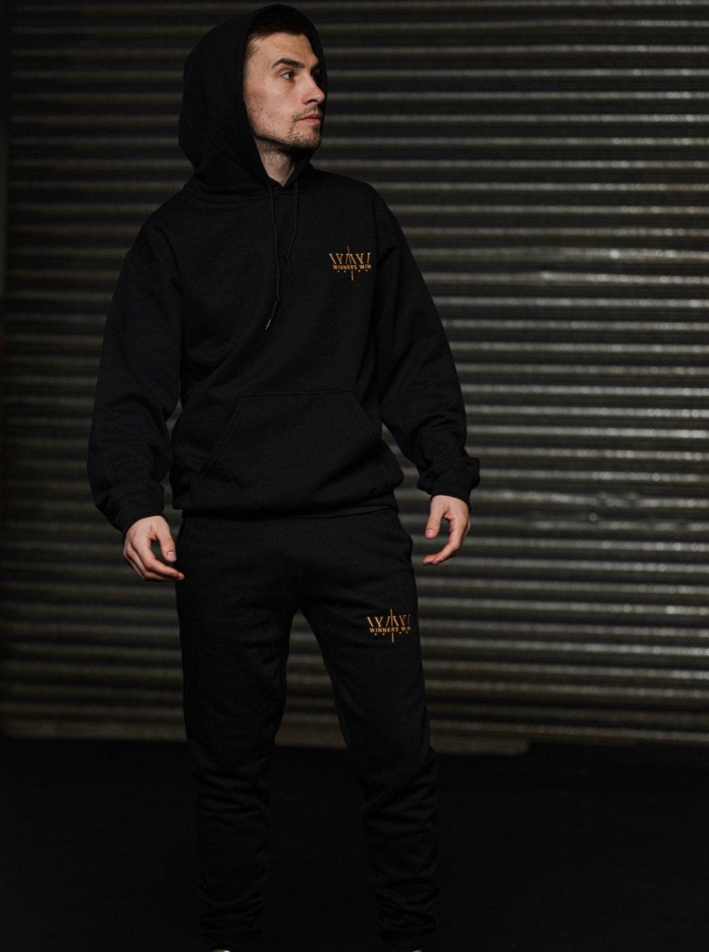 Paul Loonam wearing the black and gold full tracksuit