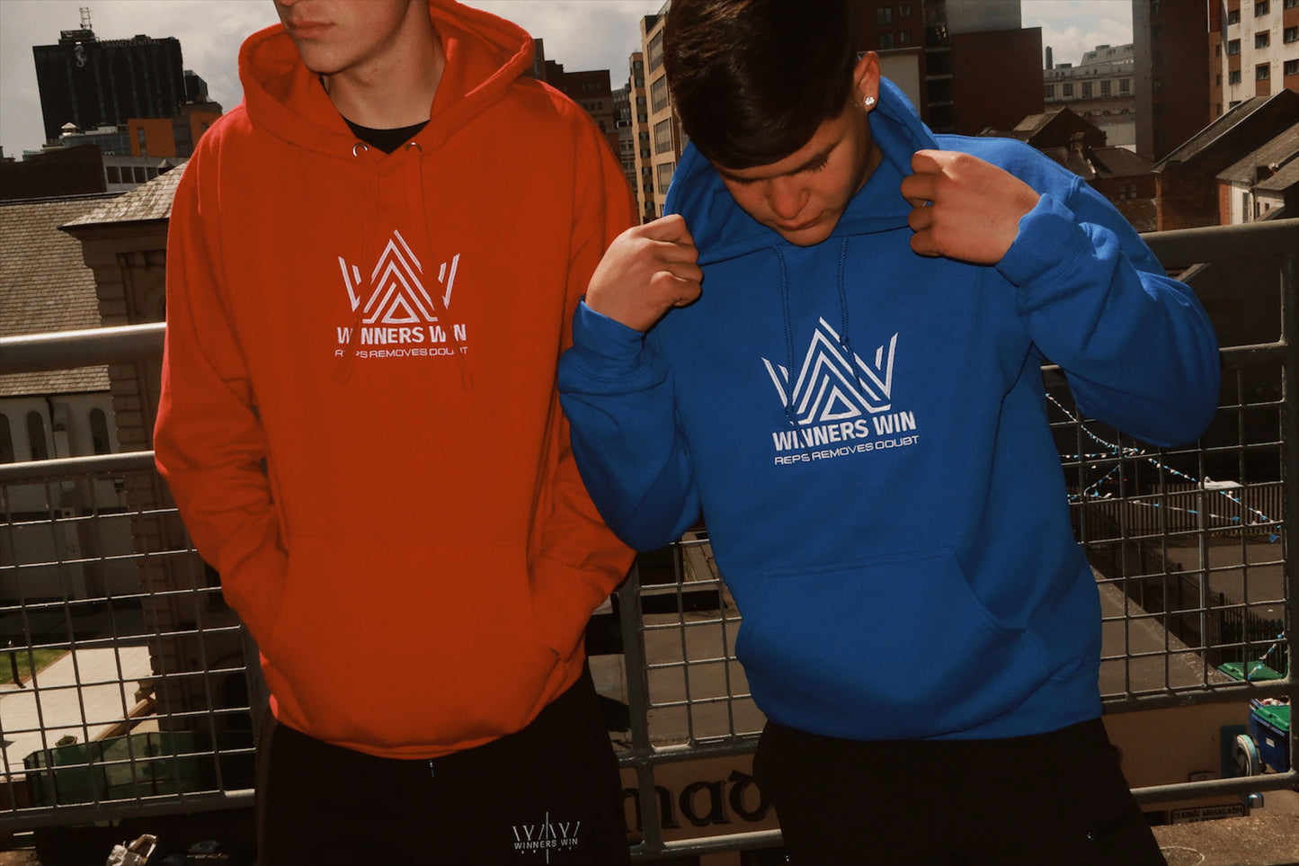 The blue and the red reps removes doubt hoodies being worn at a photoshoot in Belfast