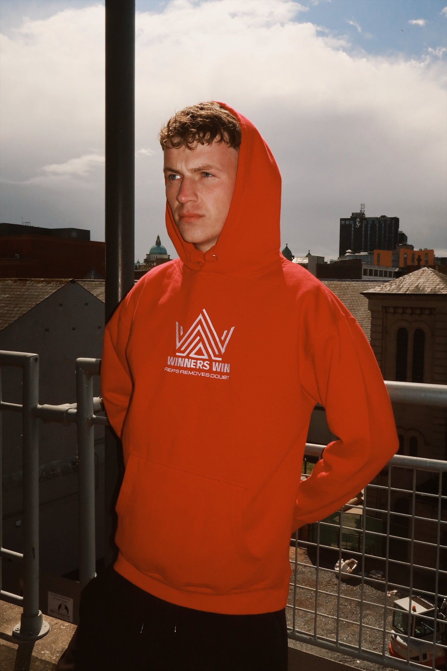 the red Winners Win red reps removes doubt hoodie being modelled in Belfast