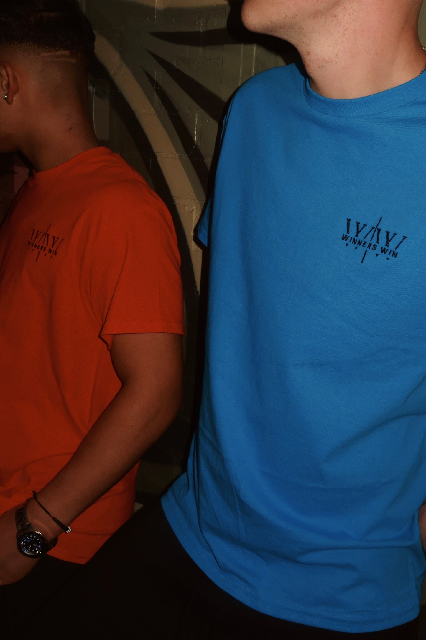 The Winners Win blue and red t-shirt being worn in a photoshoot in belfast