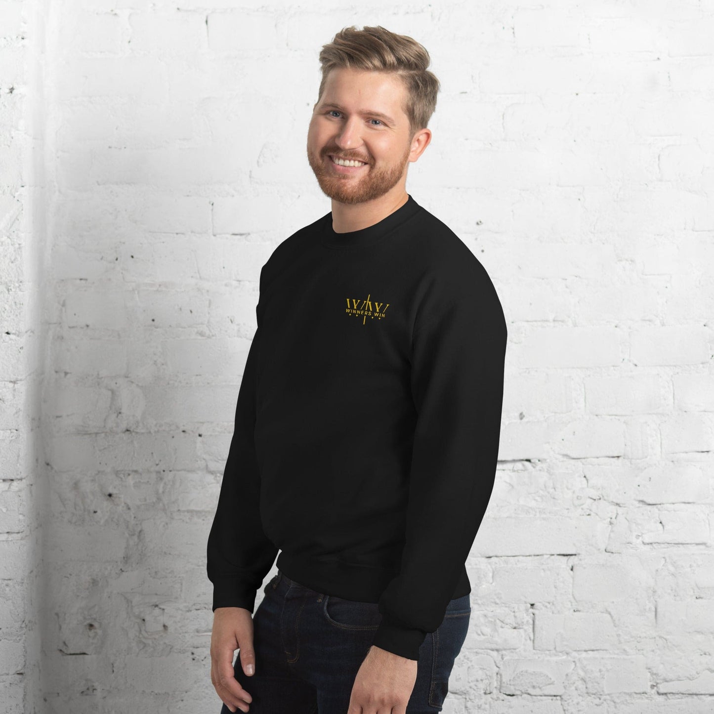 A side angle of the signature Winners Win black sweatshirt