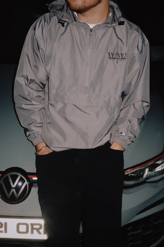 Grey Winner Win running jacket beside a 2021 Golf GTI