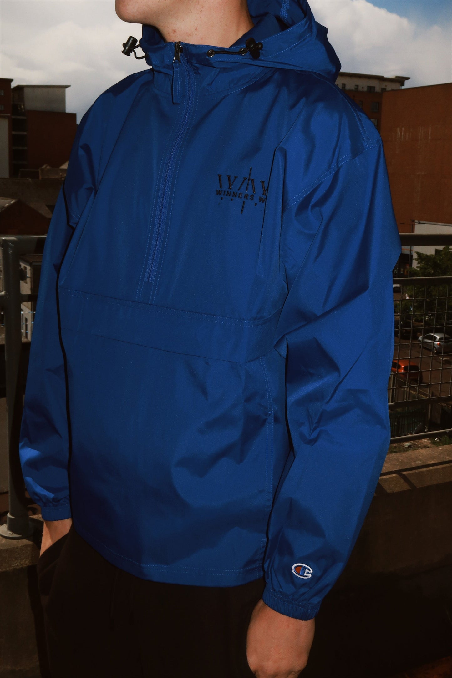 The dark blue Winners Win waterproof running jacket